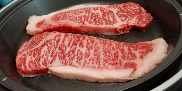 High angle view of meat in cooking pan