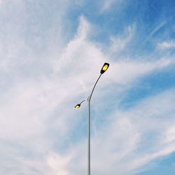 Low angle view of street light against sky