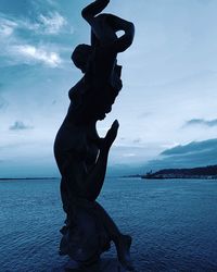 Statue of sea against sky