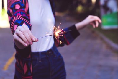 Close-up of hand holding sparklers