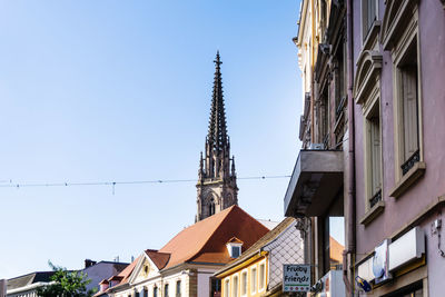 Low angle view of buildings against clear sky