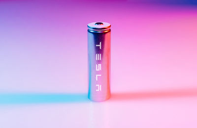 Close-up of battery on colored background