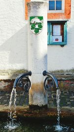 Building reflecting in water