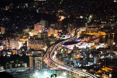 Aerial view of illuminated city at night