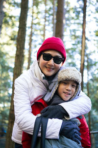 Portrait of smiling young woman in warm clothing