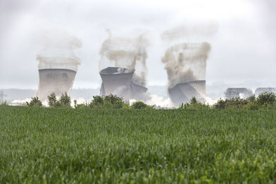 Uk, england, rugeley, cooling towers falling down during demolishing process