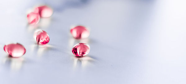 Close-up of illuminated candles on table