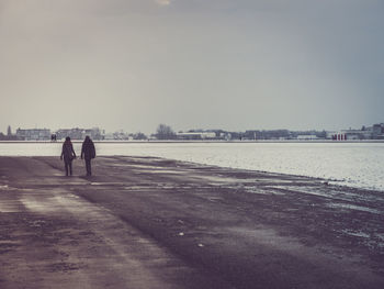Full length of woman standing in pond