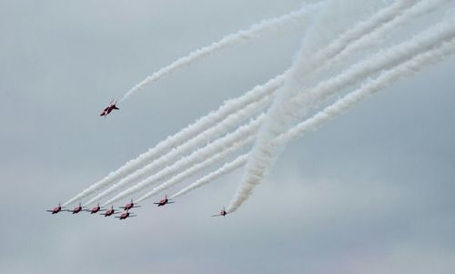 Low angle view of airshow in sky