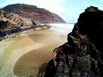 View of rock formations in water