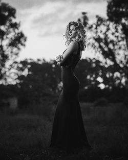 Female model in a night gown shot on the backdrop of farm ruins.