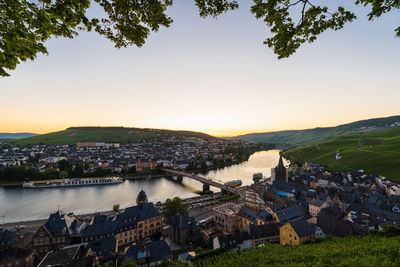 High angle view of bernkastel kues an the mosel river against sky at sunset