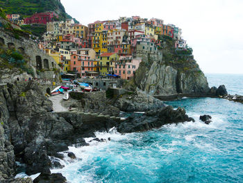 Scenic view of sea and buildings against sky