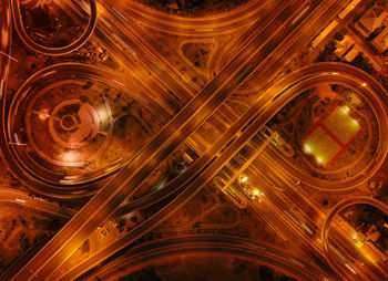 Directly above shot of intertwined highways at night