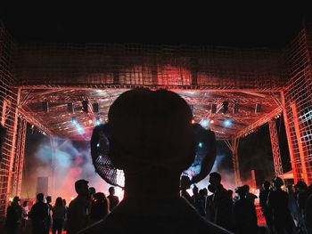 People enjoying music concert at night