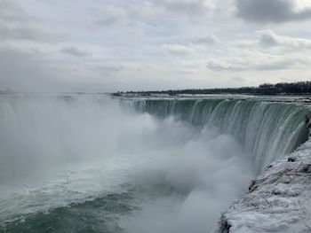 Scenic view of niagara waterfall against sky