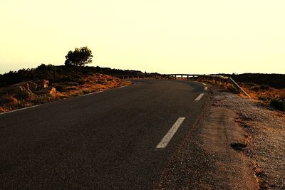 Road amidst landscape against clear sky