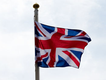 Low angle view of flag against sky