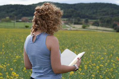Rear view of woman using mobile phone