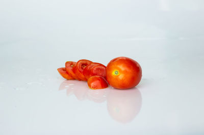 Close-up of tomatoes against white background