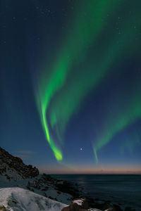 Scenic view of sea against sky at night