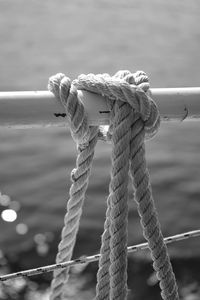 Close-up of rope tied on beach