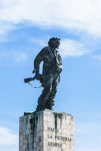 Low angle view of statue against sky