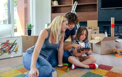 Women sitting on floor at home