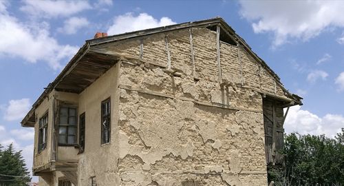 Low angle view of old building against sky