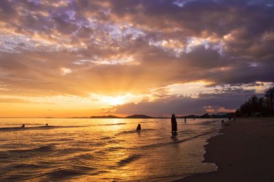 Scenic view of beach against sky during sunset