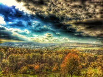 Scenic view of field against sky during sunset