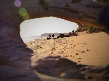 Close-up of beach against sky