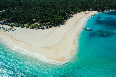 Drone view of man at beach on sunny day