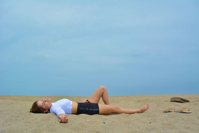 People relaxing on beach