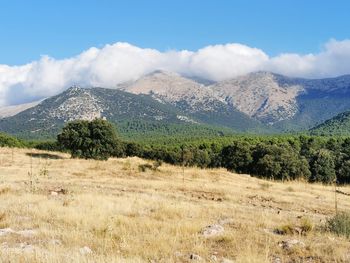 Scenic view of landscape and mountains against sky