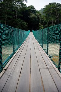 Empty footbridge over river