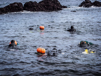 People swimming in sea