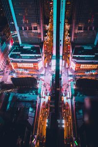 Illuminated city street at night