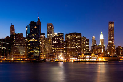 Illuminated buildings in city at night