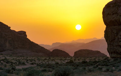 Scenic view of mountains against sky during sunset