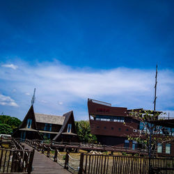 Low angle view of buildings against blue sky