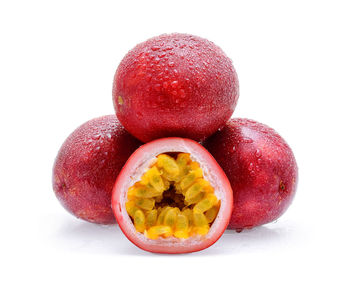 Close-up of wet apple against white background