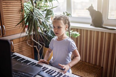 Full length of boy playing at home