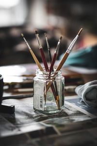 Close-up of paintbrushes on table