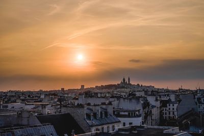 High angle view of buildings against sky during sunset