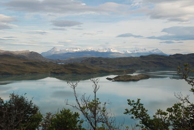 Scenic view of lake and mountains against sky