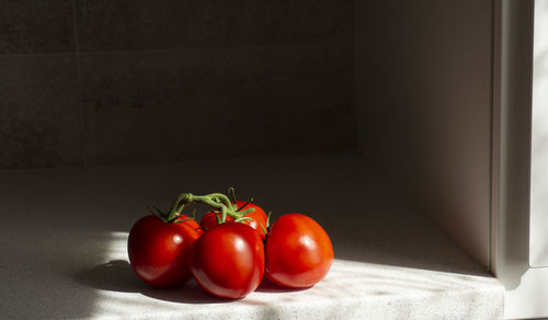 Close-up of tomatoes on table at home