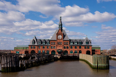 View of bridge over river against buildings