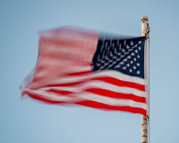 Slow exposure of the american flag waving in the wind on election day