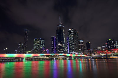 Beaufitul night view of the illuminated victoria bridge and the city skyline of brisbane